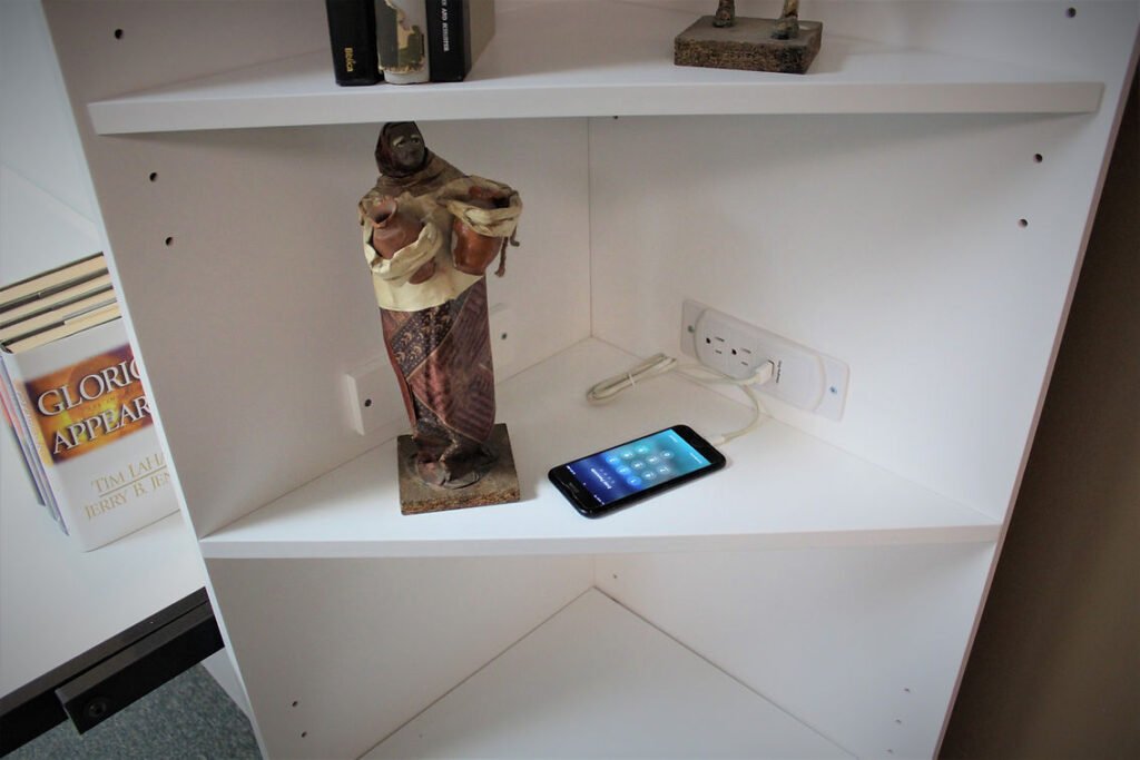 Charging station in back of bookcaseWe placed this charging station in the back of or corner bookcase.  Quick way to charge your phone or other USB accessories.