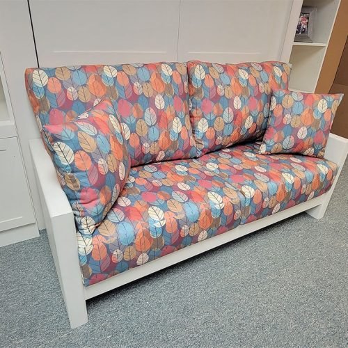 close up of the white Murphy bed Sofa with colorful print