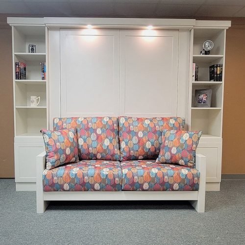 Sofa in front of white Murphy bed